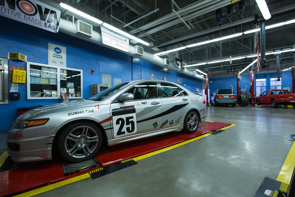 Close-up view of Río Hondo Community College’s automotive technology center, highlighting parked cars, neatly arranged tools, and nearby diagnostic stations