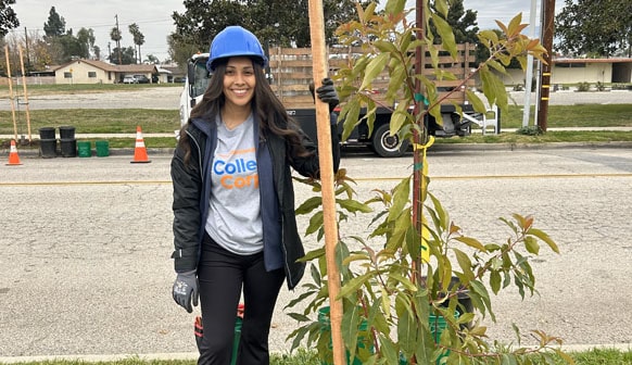 College Corps student helping plant trees